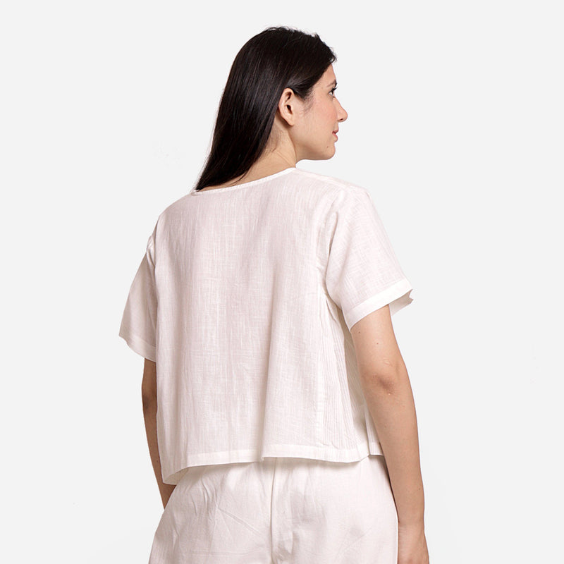 Back View of a Model wearing White Button-Down Paneled Cotton Top