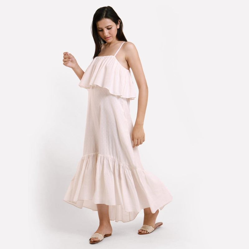 Left View of a Model wearing White Camisole Frilled Maxi Dress
