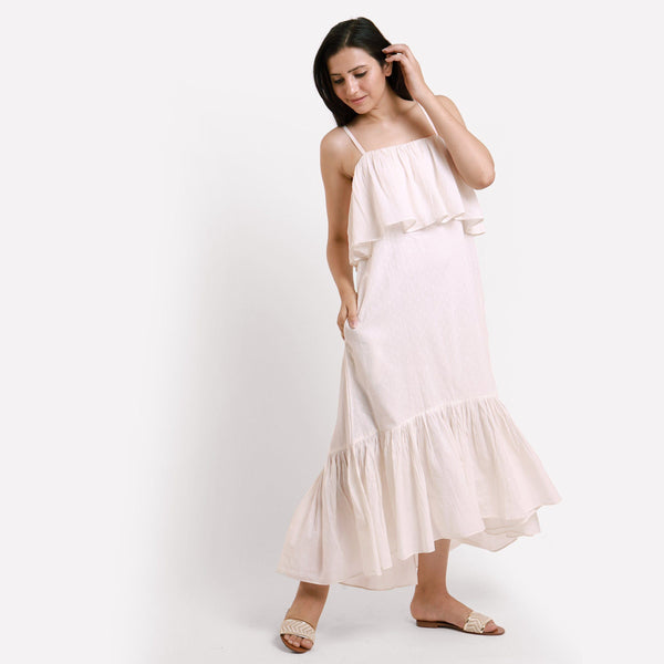 Right View of a Model wearing White Camisole Frilled Maxi Dress