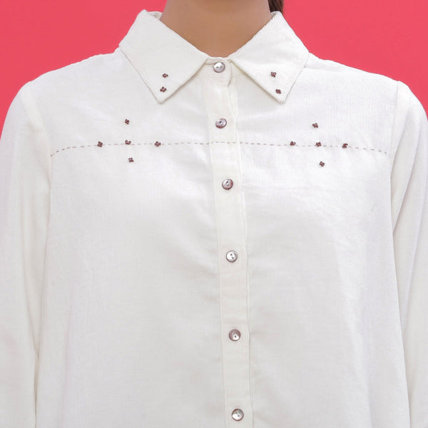 Front Detail of a Model wearing White Warm Cotton Corduroy Hand-Beaded Shirt