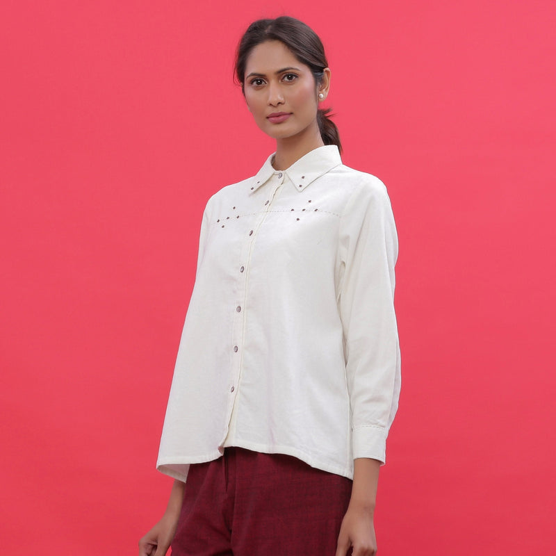 Left View of a Model wearing White Warm Cotton Corduroy Hand-Beaded Shirt