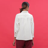 Back View of a Model wearing White Warm Cotton Corduroy Hand-Beaded Shirt