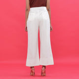 Back View of a Model wearing White Corduroy Hand Beaded Bootcut Pant