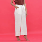 Right View of a Model wearing White Corduroy Hand Beaded Bootcut Pant
