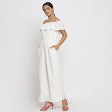 Left View of a Model wearing White Warm Cotton Corduroy Frilled Ankle Length Jumpsuit