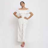 Front View of a Model wearing White Warm Cotton Corduroy Frilled Ankle Length Jumpsuit