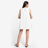 Back View of a Model wearing White Cotton Flax Kangaroo Pocket Dress