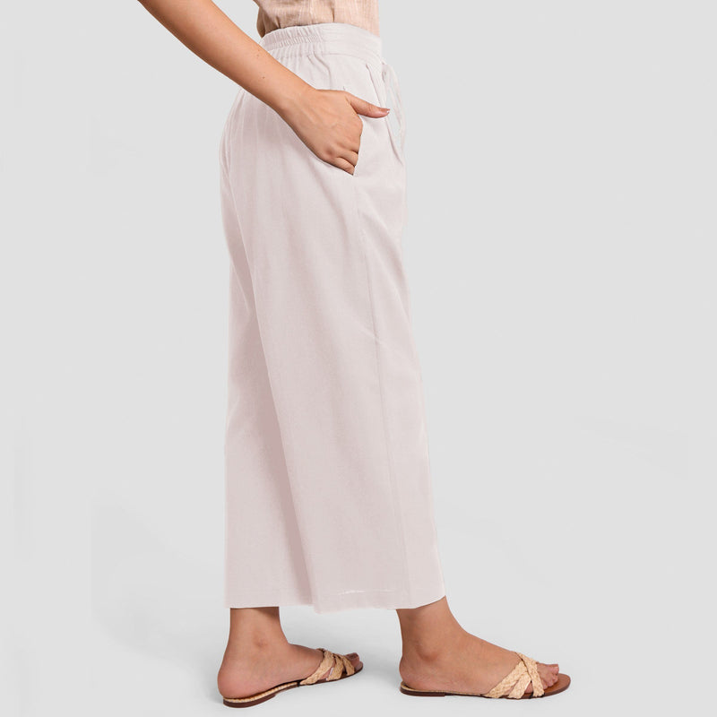 Right View of a Model wearing White Cotton Flax Wide Legged Pant