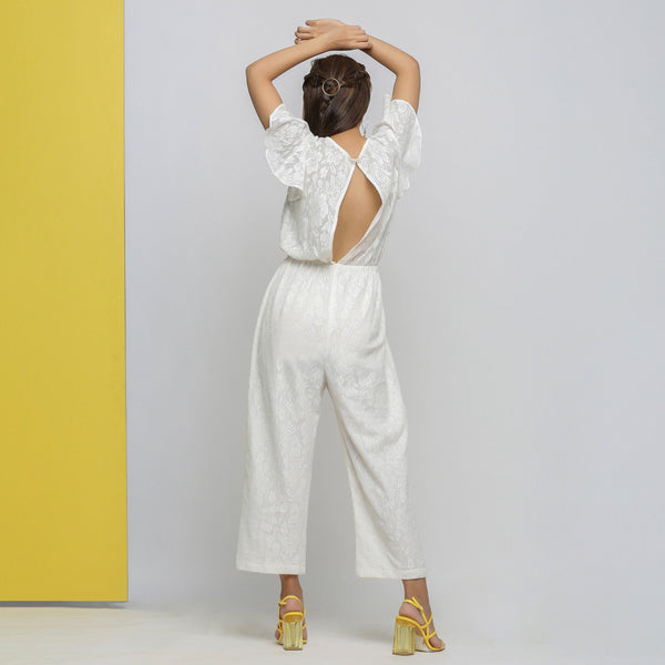 Back View of a Model wearing White Cotton Lace Hand Embroidered Jumpsuit