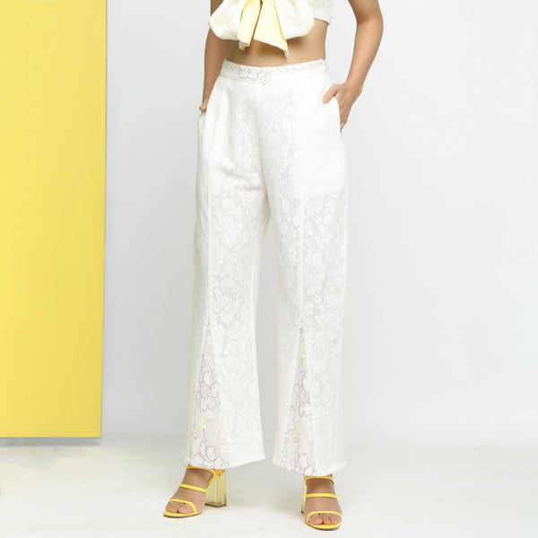 Front View of a Model wearing White Embroidered Cotton Lace Mid-Rise Paneled Pant
