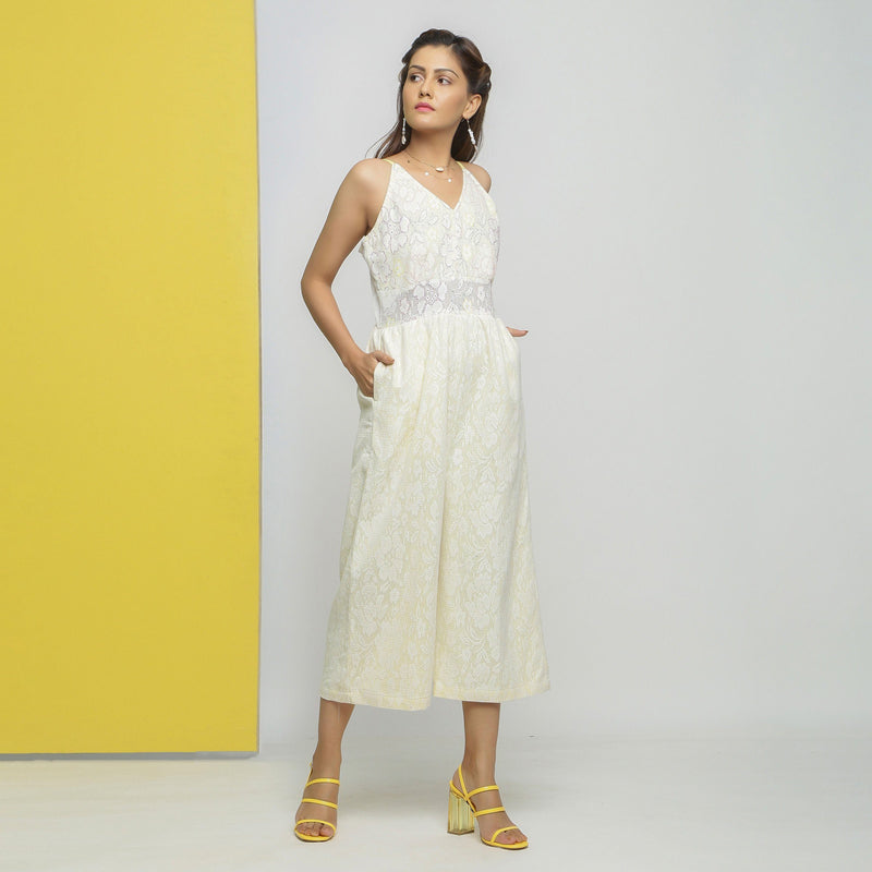 Right View of a Model wearing White Cotton Floral Straight Jumpsuit