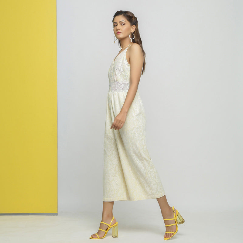 Left View of a Model wearing White Cotton Floral Straight Jumpsuit
