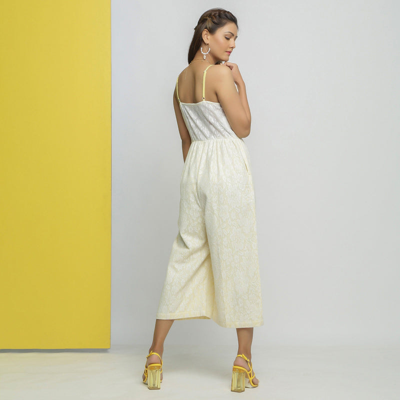 Back View of a Model wearing White Cotton Floral Straight Jumpsuit