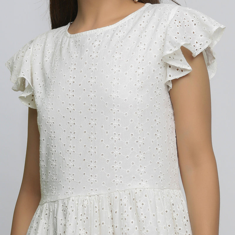 Front Detail of a Model wearing White Cotton Schiffli Short Tiered Dress
