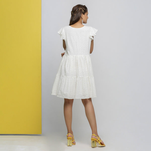Back View of a Model wearing White Cotton Schiffli Short Tiered Dress