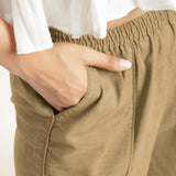 Front Detail of a Model wearing Beige Wide Legged Straight Pant