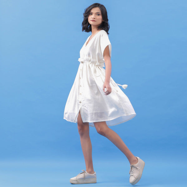 Left View of a Model wearing White Cotton V-Neck Frilled Bohemian Dress