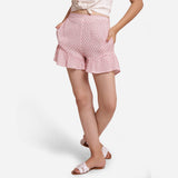 Front View of a Model wearing White Crinkled Cotton Frilled Elasticated Short Shorts