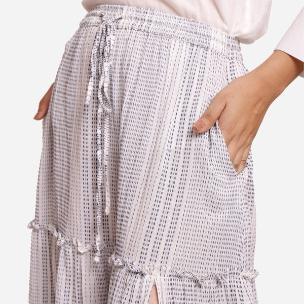 Front Detail of a Model wearing White Crinkled Cotton Elasticated Gathered Maxi Skirt