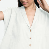Front Detail of a Model wearing White Deep Neck Button-Down Cotton Top