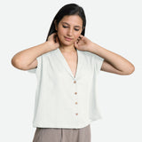 Front View of a Model wearing White Deep Neck Button-Down Cotton Top