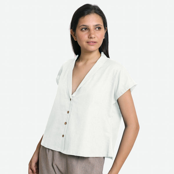 Left View of a Model wearing White Deep Neck Button-Down Cotton Top