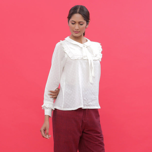 Right View of a Model wearing White Dobby Ruffled Peasant Blouse Top