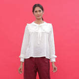 Front View of a Model wearing White Dobby Ruffled Peasant Blouse Top