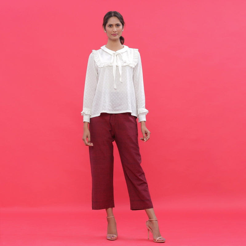 Front View of a Model wearing White Dobby Ruffled Peasant Blouse Top