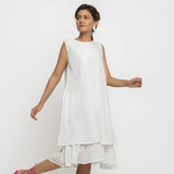 Right View of a Model wearing White Organic Cotton A-Line Knee Length Dress