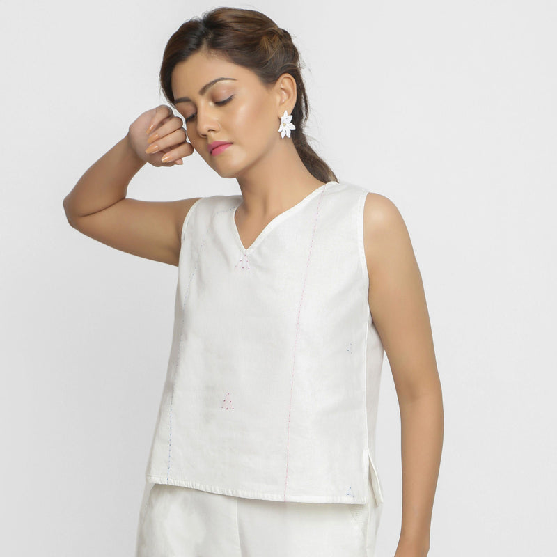 Front View of a Model wearing White Embroidered Organic Cotton Top