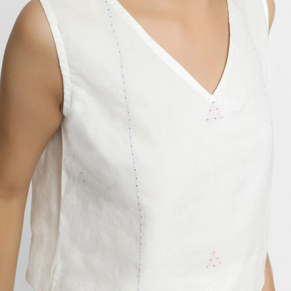Front Detail of a Model wearing White Embroidered Organic Cotton Top