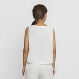 Back View of a Model wearing White Embroidered Organic Cotton Top