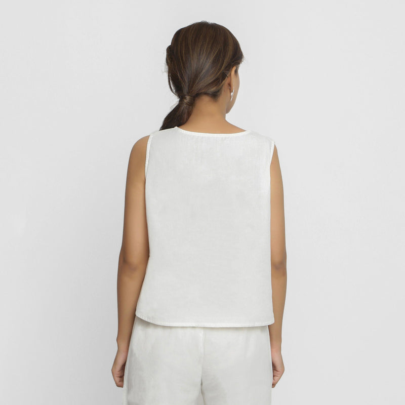 Back View of a Model wearing White Embroidered Organic Cotton Top
