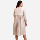 Back View of a Model wearing White Floral Block Printed Cotton Knee Length Dress