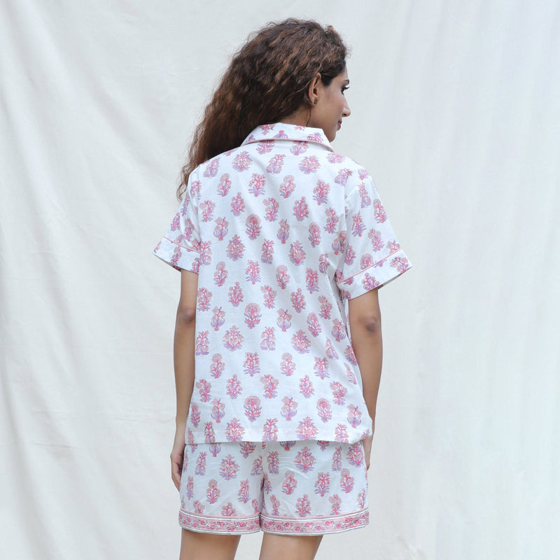 Back View of a Model wearing White and Fuchsia Block Printed Cotton Half Sleeve Shirt