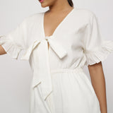 Front Detail of a Model wearing White Frilled Sleeve Cotton Playsuit