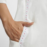 Close View of a Model wearing White Organic Cotton Hand Beaded Button-Down Midi Dress