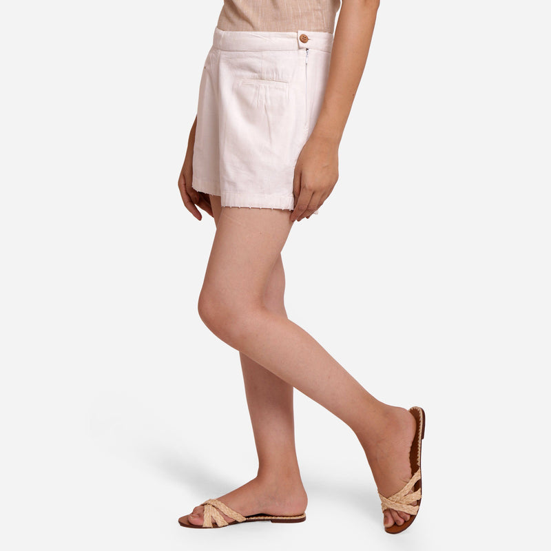 Left View of a Model wearing White Hand Beaded Short Cotton Shorts