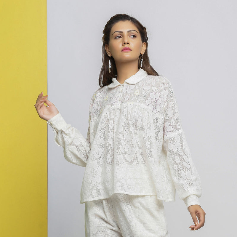 Front View of a Model wearing White Floral Hand-Embroidered Cotton Lace Yoked Shirt