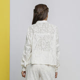 Back View of a Model wearing White Floral Hand-Embroidered Cotton Lace Yoked Shirt