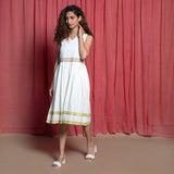 Left View of a Model wearing White Organic Cotton Block Print Lace Sundress