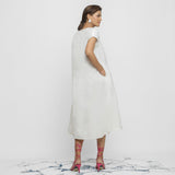 Back View of a Model wearing White Organic Cotton Lace Midi Flared Dress