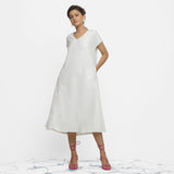 Front View of a Model wearing White Organic Cotton Lace Midi Flared Dress