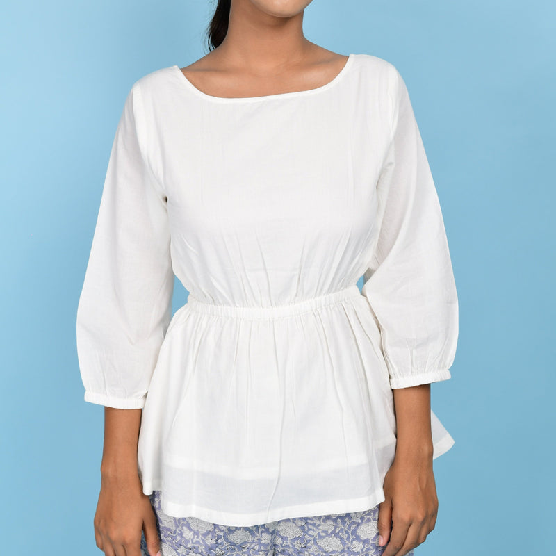 Front Detail of a Model wearing White Organic 100% Cotton Round Neck Peplum Top