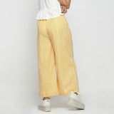 Back View of a Model wearing Yellow Striped Hand Screen Print Elasticated Wide Legged Cotton Pant