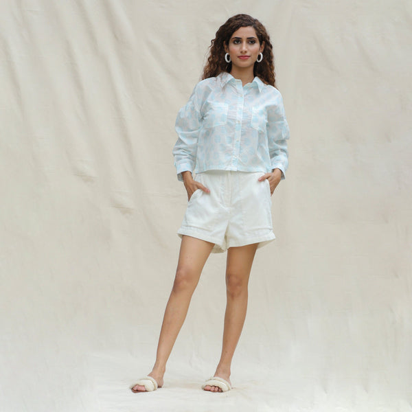 Front View of a Model wearing White and Powder Blue Paisley Block Printed Cotton Button-Down Shirt