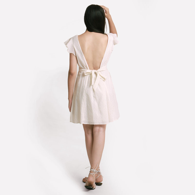 Back View of a Model wearing White Princess Line Backless Short Dress