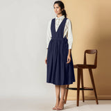 Left View of a Model wearing Midnight Blue Cotton Flax Pinafore Midi Wrap Dress