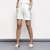 Front View of a Model wearing White Crinkled Cotton Elasticated Short Shorts